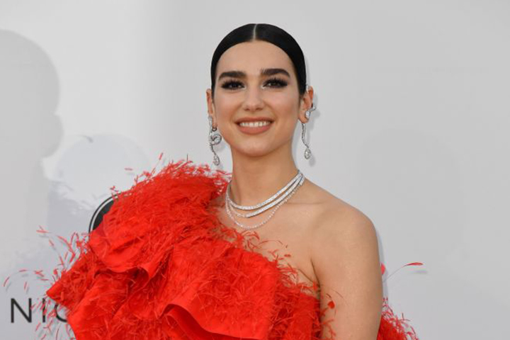 British singer-songwriter Dua Lipa poses as she arrives on May 23, 2019 for the amfAR 26th Annual Cinema Against AIDS gala at the Hotel du Cap-Eden-Roc in Cap d'Antibes, southern France, on the sidelines of the 72nd Cannes Film Festival. (Photo by Alberto PIZZOLI / AFP)        (Photo credit should read ALBERTO PIZZOLI/AFP/Getty Images)